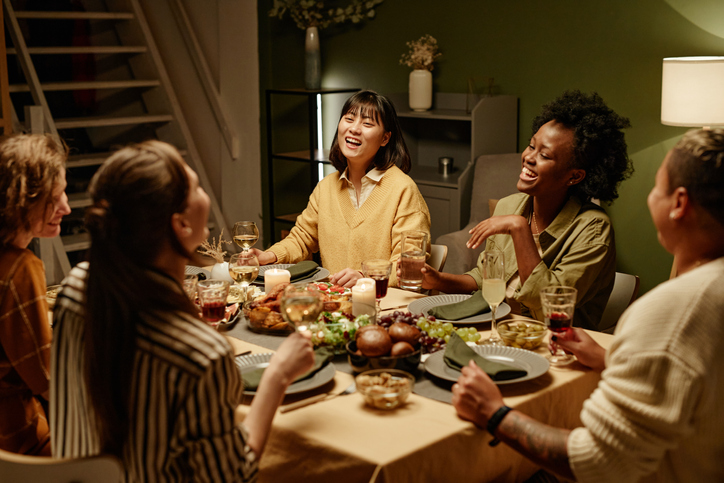 Friends at a table eating dinner together