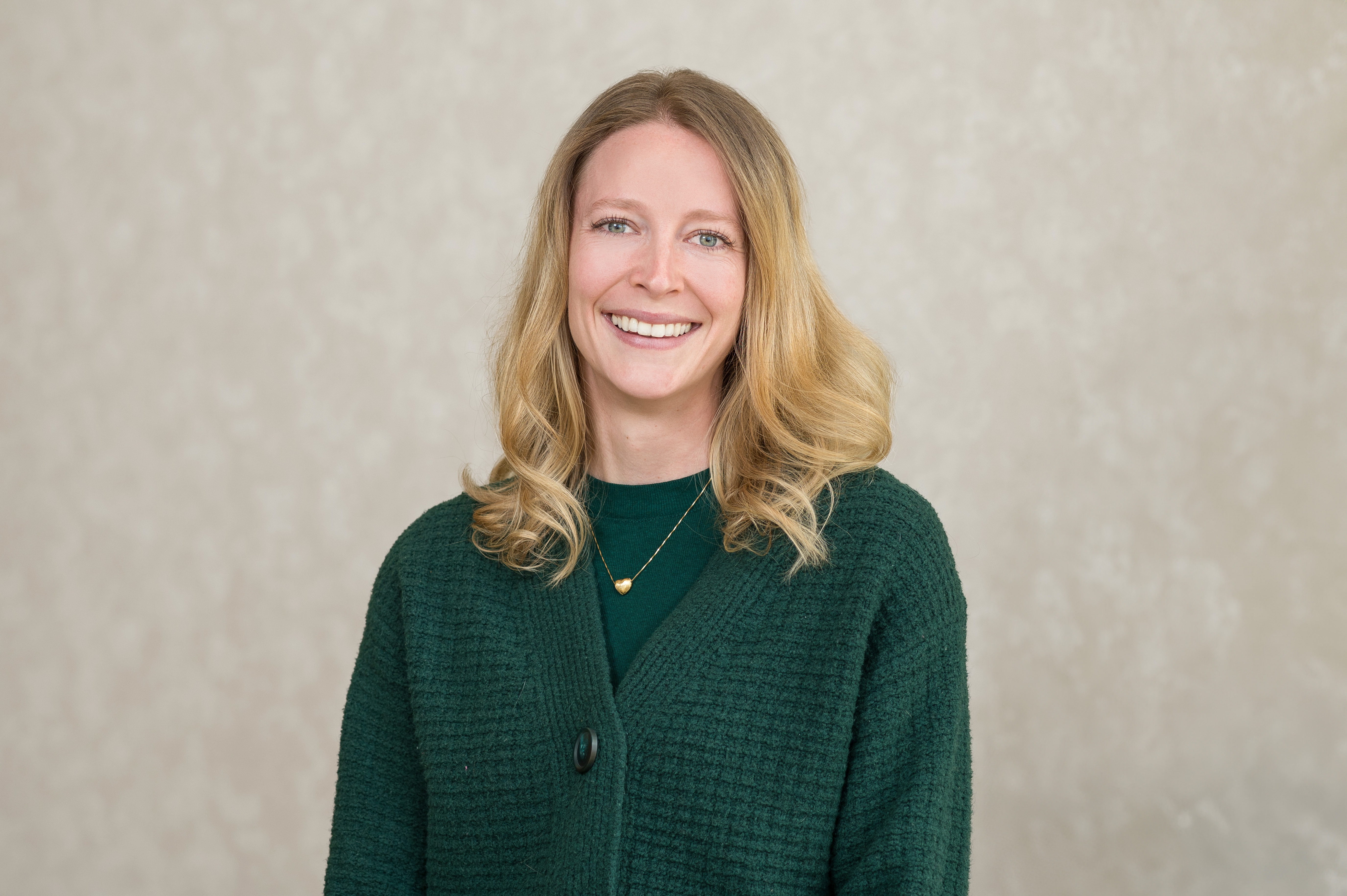 Headshot of provider wearing a green sweater