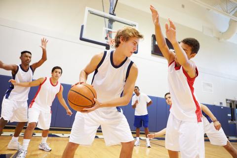 Young men playing basketball