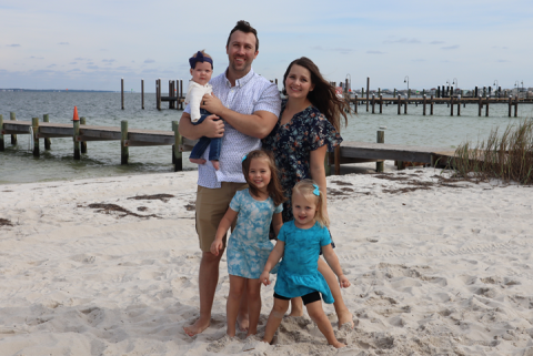 Pediatrician Geoff Wood, DO with his family on the beach